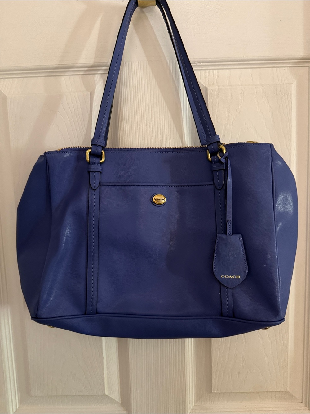 Coach Peyton leather shoulder bag. purple with gold accent over the shoulder bag